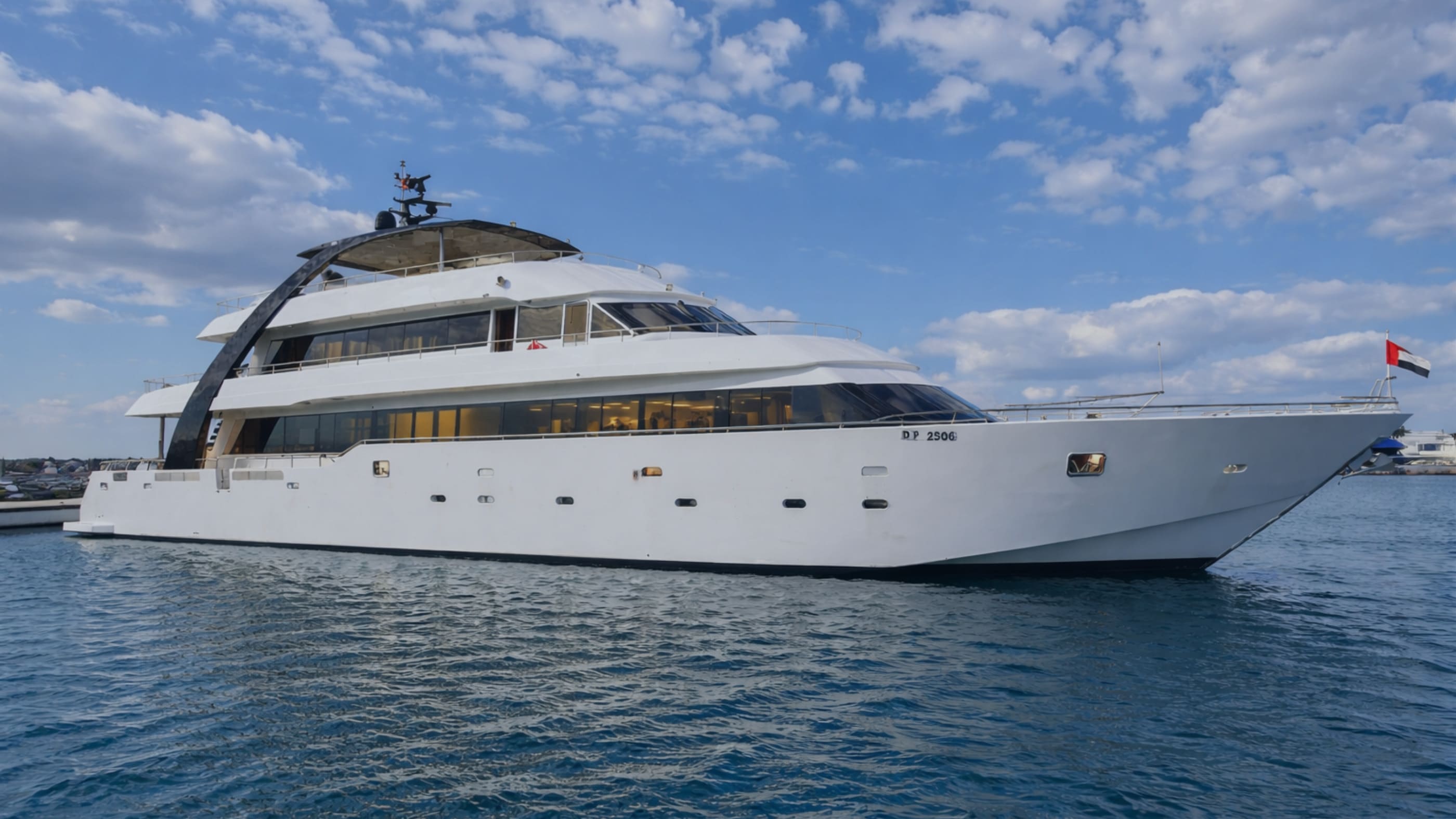 Carmen, XTASEA's flagship luxury yacht, sailing off the Dubai Marina skyline